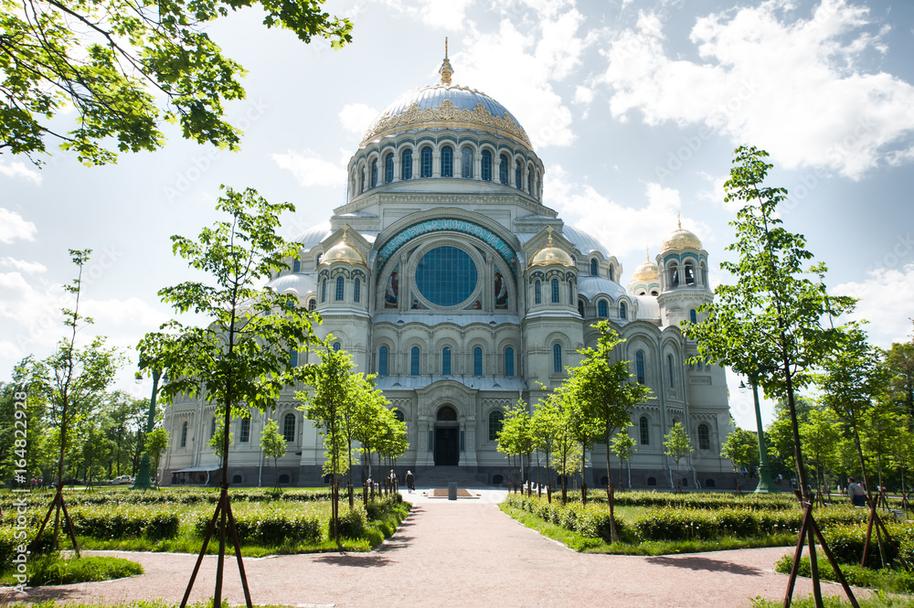 Naval cathedral of Saint Nicholas in Kronstadt, St.-Petersburg, Russia. Cathedral against the blue sky and clouds, summer, sunny day