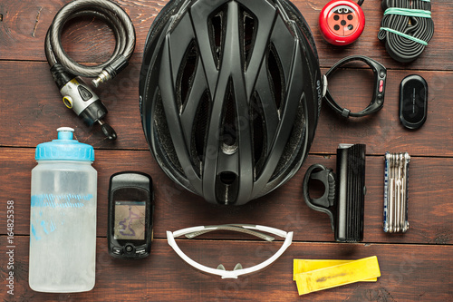 old used cycling accessories on wooden table