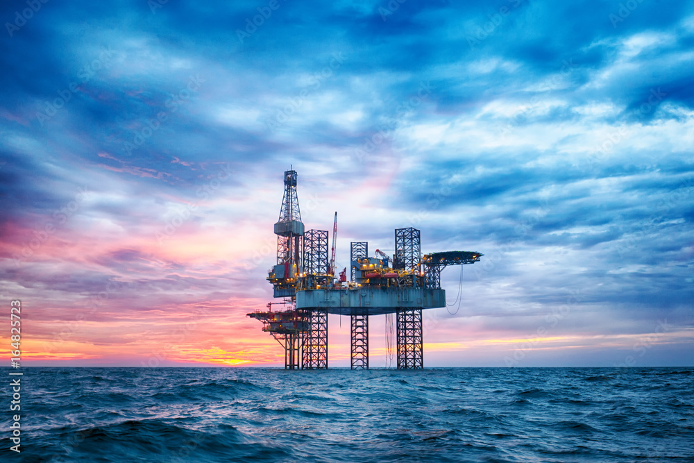 HDR of Offshore Jack Up Rig in The Middle of The Sea at Sunset Time 