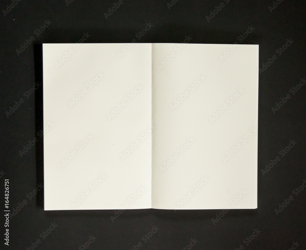 Open blank notebook paper on black background and copy space for texts Open blank notebook paper on black background and copy space for texts
