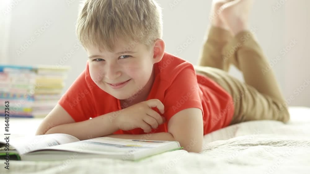 Funny boy with a book. An elementary school student. Funny boy with a book. An elementary school student.