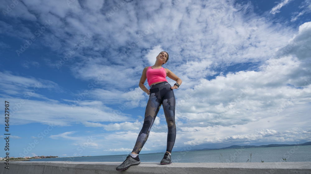 sporty happy young girl on the beach