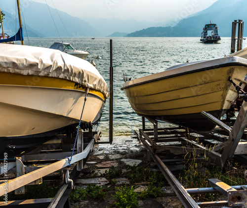 Boats on Como lake coast, Italy