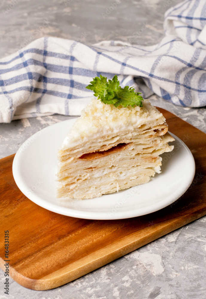 Cake Napoleon. Russian cuisine, multi layered cake with pastry cream, close up Cake Napoleon. Russian cuisine, multi layered cake with pastry cream, close up