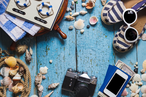Striped espadrilles, camera and maritime decorations, top view