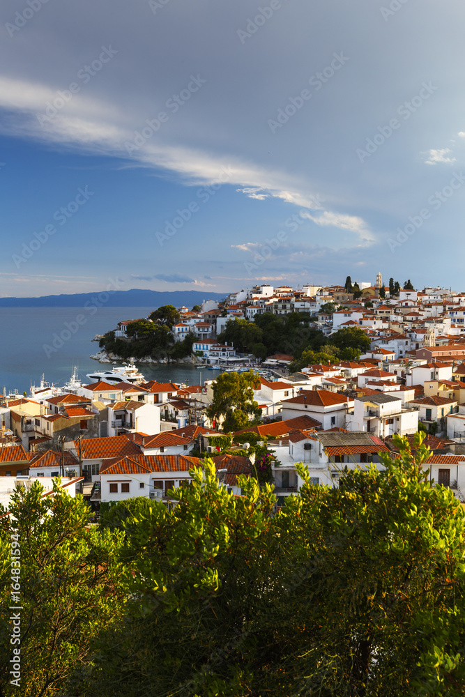 View of the old harbour on Skiathos island and Euboea in the distance, Greece.
