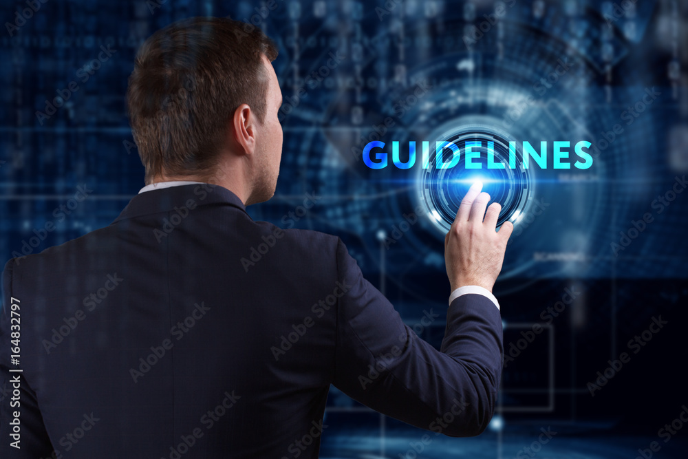 Business, Technology, Internet and network concept. Young businessman working on a virtual screen of the future and sees the inscription: Guidelines