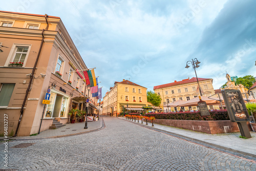 VILNIUS  LITHUANIA - JULY 9  2017  Tourists visit city streets at sunset. Vilnius attracts 2 million tourists annually