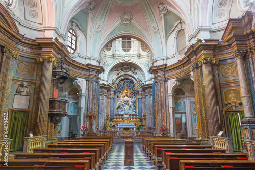 TURIN, ITALY - MARCH 16, 2017: The nave of baroque church Chiesa di Santa Maria di Piazza with the main altar by Pietro Francesco Guala (1698 - 1757).