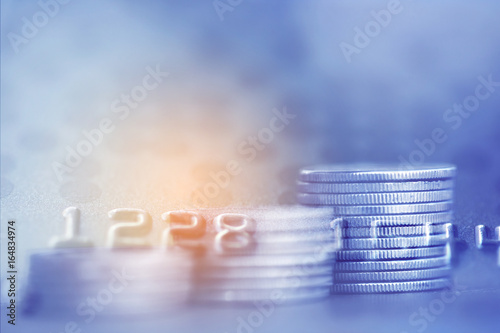Double exposure Rows of coins of Credit cards on the table,finance and business concept,Money,soft focus and blurred style,dark tone.