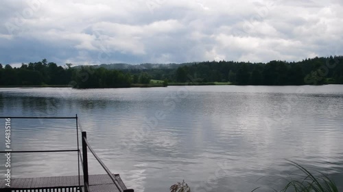 Pan view of village pond. Country pond photo