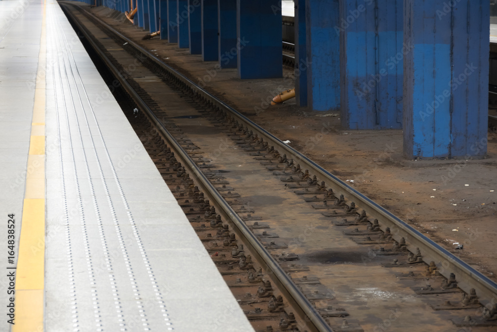 Railway track at the Train station platform Railway track at the Train station platform