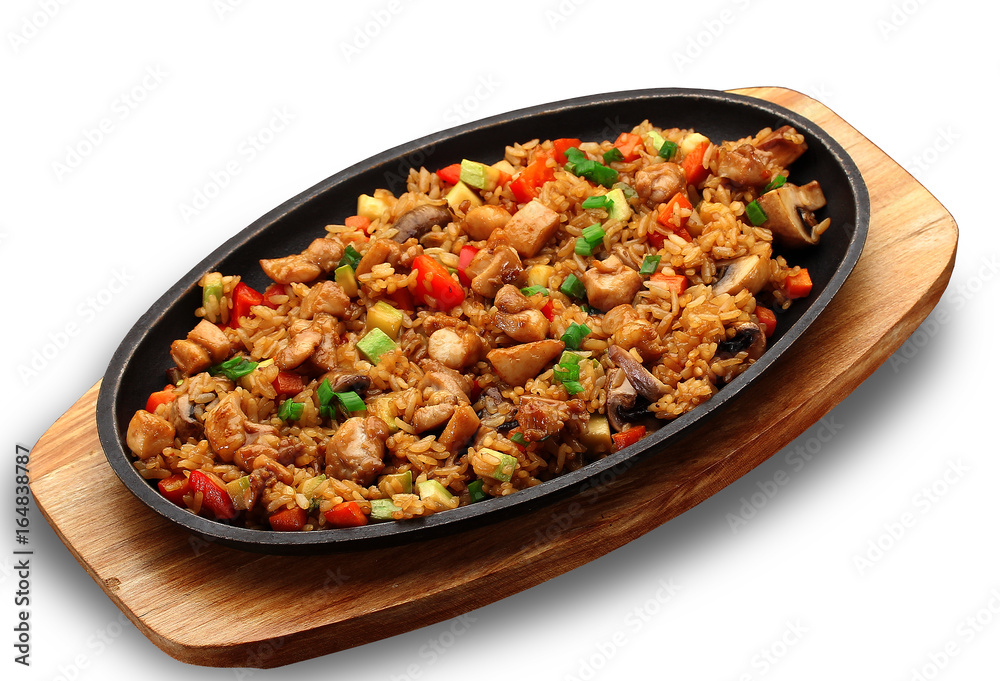 Rice with meat and vegetables on a stone plate isolated on white background Rice with meat and vegetables on a stone plate isolated on white background