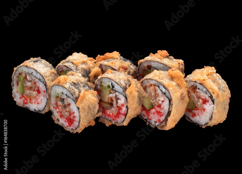 Japanese cuisine. Tempura eel sushi roll Japanese cuisine. Tempura sushi roll over dark background.