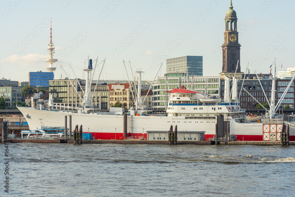 Skyline of the City seen from the right harbor side in Hamburg. The Reefer ship Cap San Diego in the harbor of Hamburg. The city has has plenty of tourists attractions