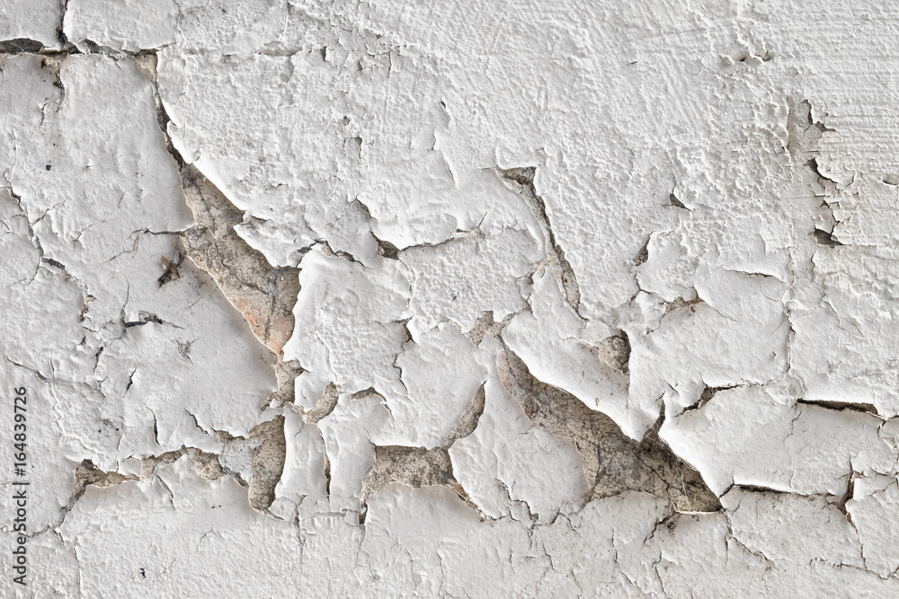 Paint peeling from dirty white exterior wall Paint peeling from dirty white exterior wall