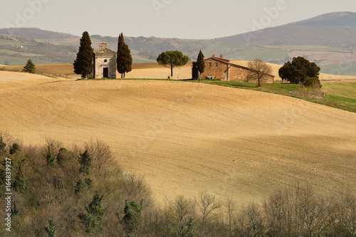 Tuscany landscape, little chapel of Madonna di Vitaleta, Pienza, Siena, Italy. photo