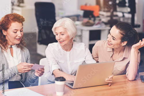 Competent business ladies briefing their boss