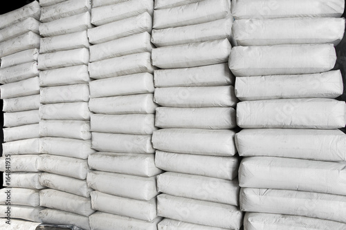 Pile of white plastic sacks in warehouse
