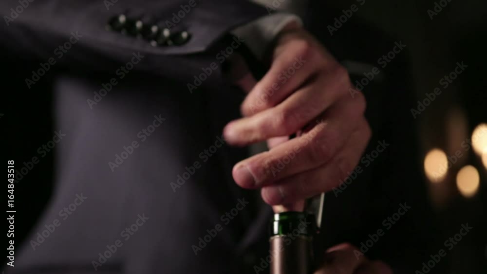Uncorking wine bottle
