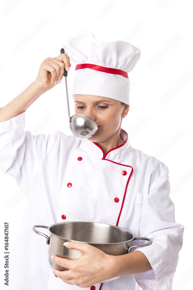 Studio shot of a young chef woman tasting soup with a ladle