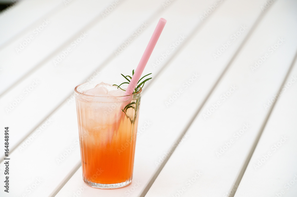 Fresh cold ice drink on white wooden surface Fresh cold ice drink on white wooden surface