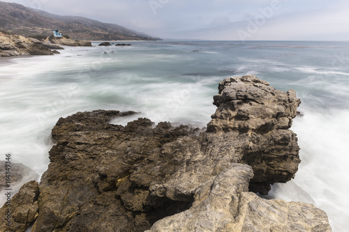 Leo Carrillo State Beach rocky point with motion blur surf in Malibu  California.