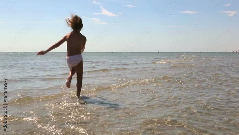 The waves of the north Sea are rolled on a sandy beach. Background of the sea The waves of the north Sea are rolled on a sandy beach. Background of the sea