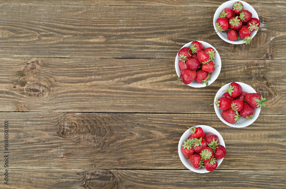 Strawberries ripe red on wooden table Strawberries ripe red on wooden table