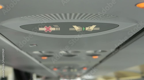 Close-up of Fasten Seatbelt Sign on Commerical Aircraft