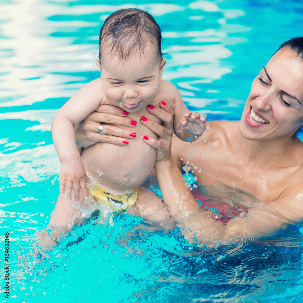 Baby boy with his mother in the swimming pool Baby boy with his mother in the swimming pool