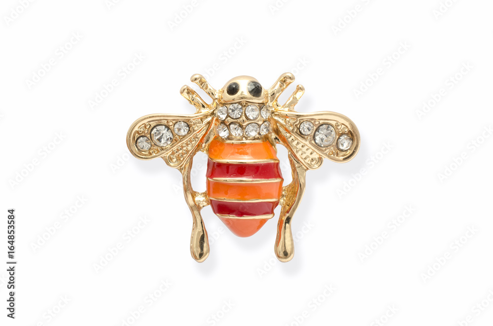 Golden brooch bee with diamonds isolated on white