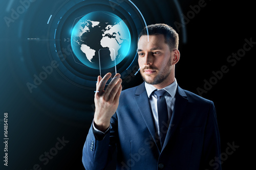 businessman with smartphone and virtual globe