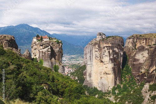 Monastery Agia Triada (Holy Trinity) at the Meteora rocks in Thessaly,  Kalambaka town  in distance, Greece © happyimages
