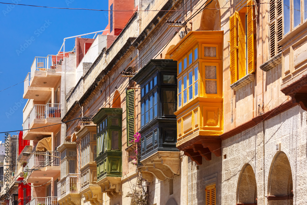 The traditional Maltese colorful wooden balconies in Sliema, Malta The traditional Maltese colorful wooden balconies in Sliema, Malta