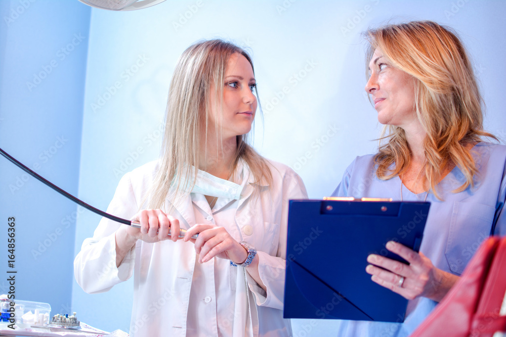 Dentist and nurse working together in dental clinic. Dentist and nurse working together in dental clinic.
