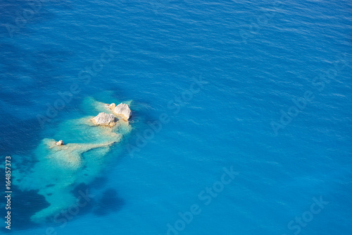 Aerial view of beautiful sea with azure water and rocks 
