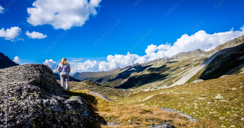 Girl admires the view Near the Stelvio pass, Switzerland