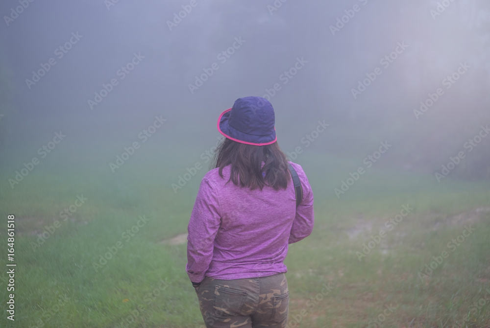 Cute girl in the middle of a foggy haze. Cute girl in the middle of a foggy haze.