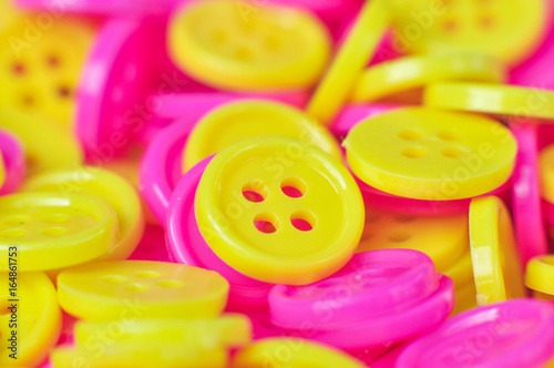 Yellow and pink buttons (clasper)