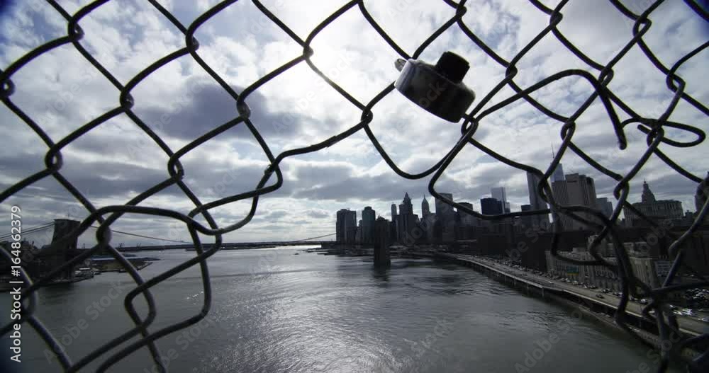 POV, view of Brooklyn Bridge through chain link fence POV, view of Brooklyn Bridge through chain link fence