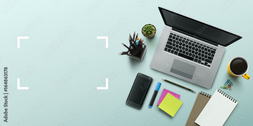 Office workplace with laptop, notebook, office supplies and stationery on turquoise background. Solution, business planning, creative, design, learning, start up or working flat lay top view concept.