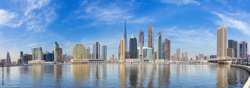 DUBAI, UAE - MARCH 29, 2017: The panorama with the new Canal and skyscrapers of Downtown.