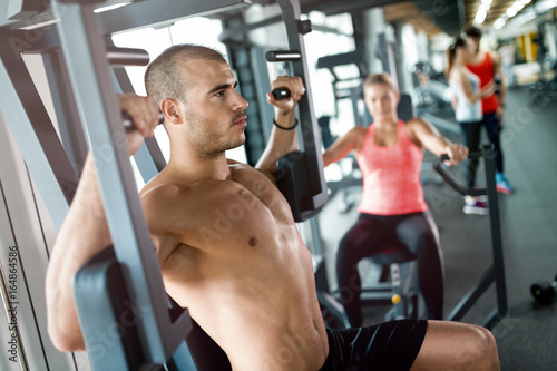 Attractive man and beautiful woman workout in gym © NDABCREATIVITY