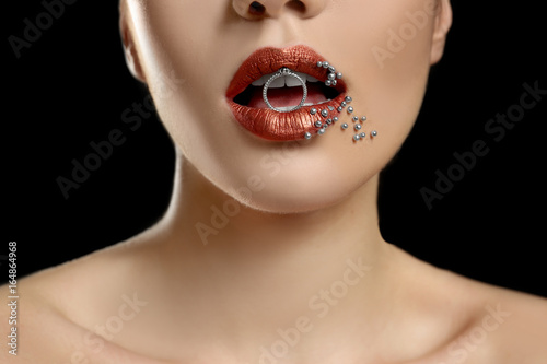 Young woman holding ring be...