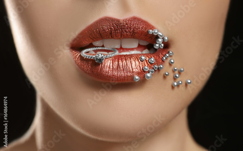 Young woman holding ring be...