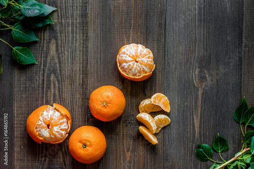 Fresh oranges and mandarins on wooden table background top view copyspace