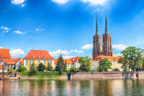 WROCLAW, POLAND - JULY 18, 2017: Wroclaw Old Town. Cathedral Island (Ostrow Tumski) is the oldest part of the city. Odra River, boats and historic buildings on a summer day.