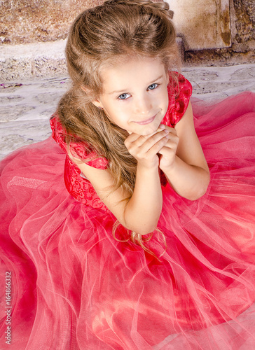 little girl in a red dress