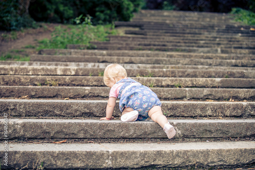 lonely girl crawling on the stair
